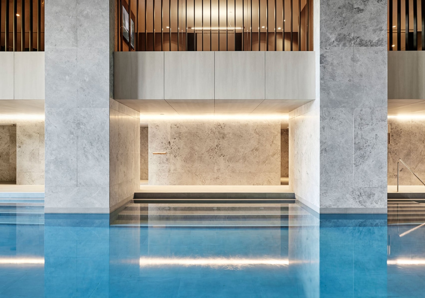 A pool with a steam room and sauna